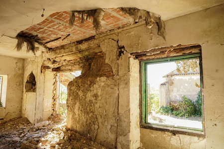 Fallen roof in a hall in an abandoned big house.の写真素材