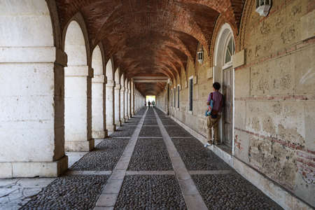A man in waiting in a long corridor in Aranjuez, Madrid, Spain, October, 2017のeditorial素材
