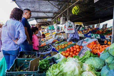 Street market in Madrid, Spain. People in a vegetables stand.September, 2017.のeditorial素材