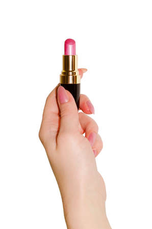 Lipstick in a female hand closeup isolated on white .の写真素材