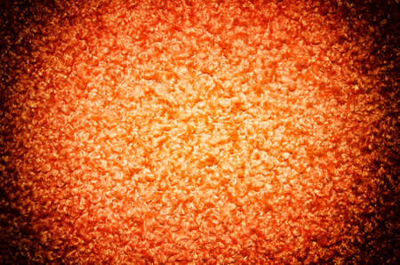 Background of orange fabric close up の写真素材
