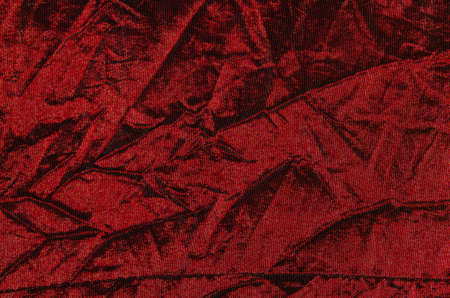 Crumpled red cloth close up the entire picture.