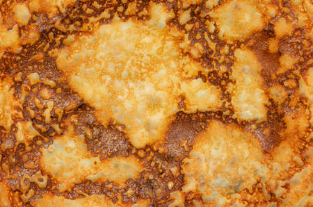 Fried pancake yellow closeup on the entire frame.の写真素材