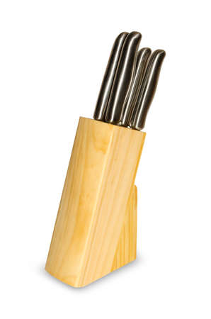 Set of kitchen knives in a wooden stand isolated on white background.の写真素材
