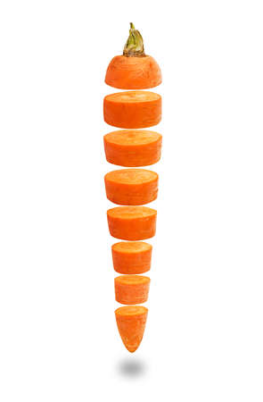 Fresh raw carrots cut into equal slices isolated on white backgroundの写真素材
