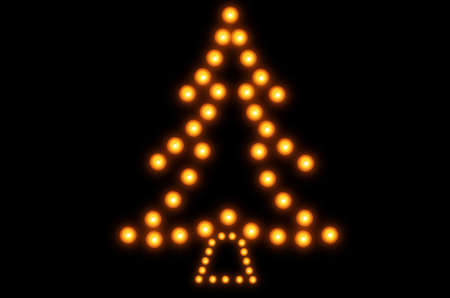 Christmas tree made and burning candles on a black backgroundの写真素材