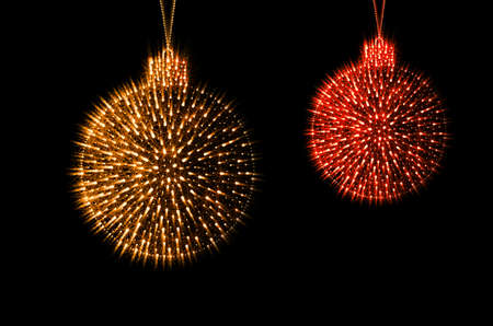 Christmas decoration balls sparkling red and gold color on a black backgroundの写真素材
