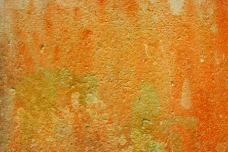 Orange dirt wall texture backgroundの写真素材