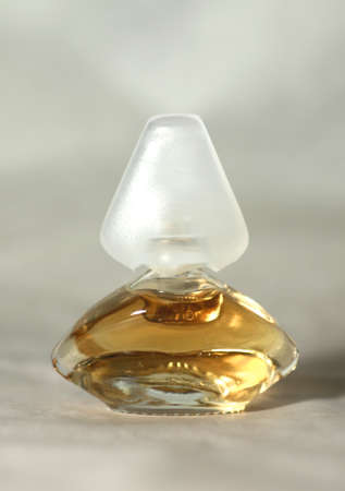 a bottle of perfume against light backgroundの写真素材