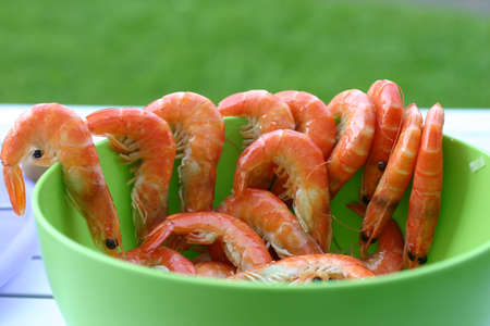 With a bowl of shrimpの写真素材