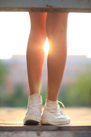 long legs and sunsetの写真素材