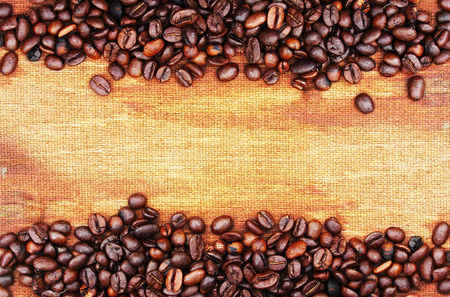 coffee beans on wood backgroundの写真素材