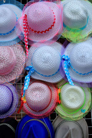 Row Of Colorful Vintage Weaving Hats Hanging On The Grilleの写真素材