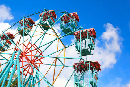 Empty Ferris Wheel Over Blue Sky