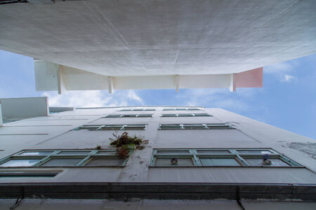Worm view Between Two Building with Blue Sky and White Cloud