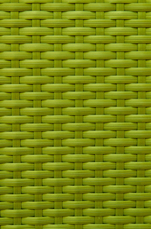 Synthetic rattan texture weaving background as used on outdoor garden furniture
