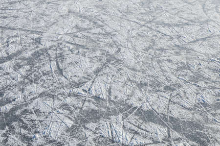 skating ice  ring texture covered with snowの写真素材