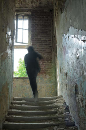 alone person walking in ruinsの写真素材