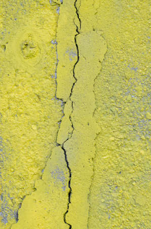 yellow wall texture with crackの写真素材