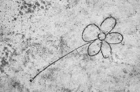 closeup to flower sketche on sand backgroundの写真素材