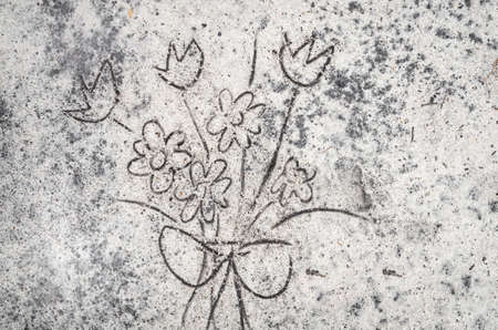 closeup to flowers sketche on sand backgroundの写真素材