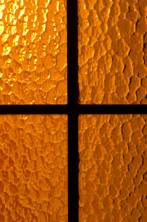 back lit glass door warm lightの写真素材