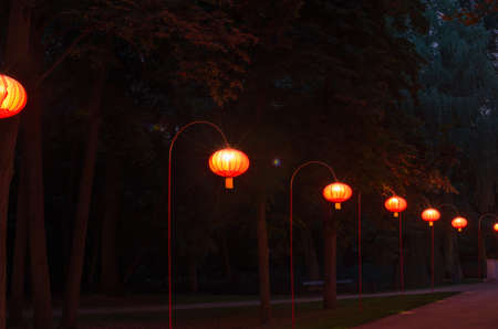 chinese lanterns in Warsaw Lazienki Park at nightの写真素材