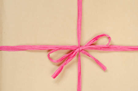 brown cardboard package background tied with twineの写真素材