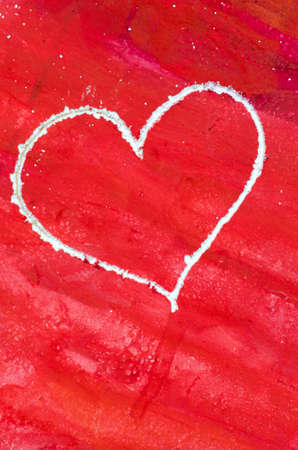 heart shape on red painted backgroundの写真素材