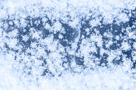 white snowflakes on blue  iceの写真素材