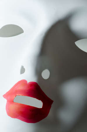 white mask with red lipsの写真素材