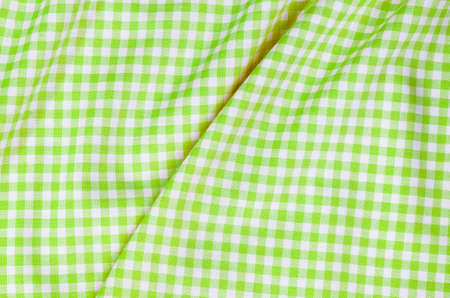 background of green checkered fabric tablecloth