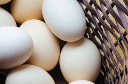 Eggs in easter wicker basketの写真素材