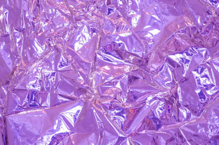 crumpled aluminium foil background textureの写真素材