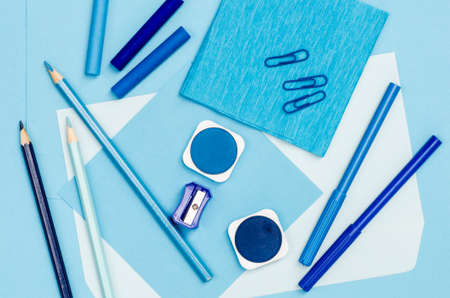 group of blue color school supplies