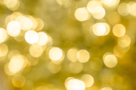 blurred gold bokeh abstract lights backgroundの写真素材
