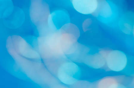 blue abstract blurred bokeh lights backgroundの写真素材
