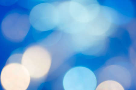 blue abstract blurred bokeh lights backgroundの写真素材