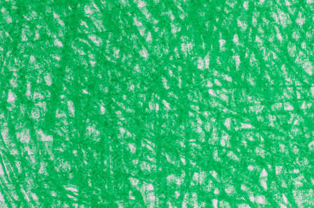 green crayon drawings on white paper background textureの写真素材