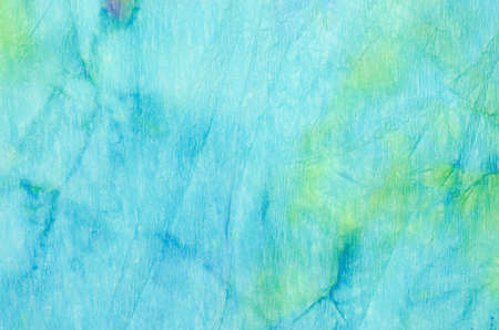 blue watercolor painting on crepe paper background textureの写真素材