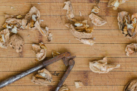 nutcracker and nuts on wooden backgroundの写真素材