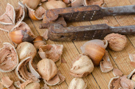 nutcracker and nuts on wooden backgroundの写真素材