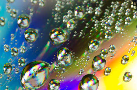 waterdrops on rainbow colors background selective focusの写真素材