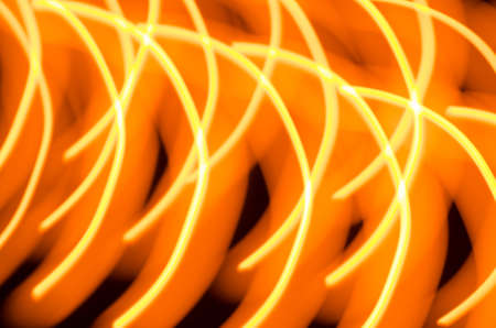 orange background with blurred candle lightsの写真素材