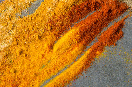 multicolored ground spices turmeric, paprica, pepper, ginger, chilli,の写真素材