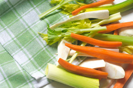 raw peeled vegetables on table clothの写真素材