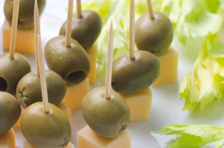 appetizer with cheese and olives  on plateの写真素材
