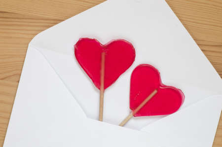 red transparent heart shaped lollipopsの写真素材