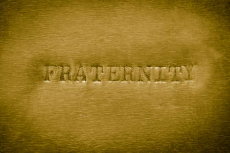 word fraternity printed on golden metallic background textureの写真素材