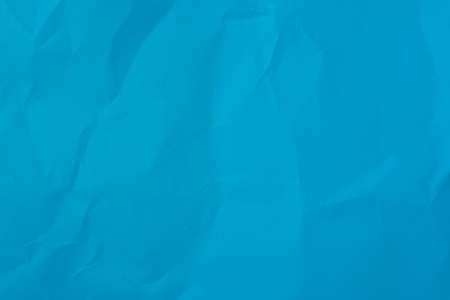 crumpled blue paper background textureの写真素材